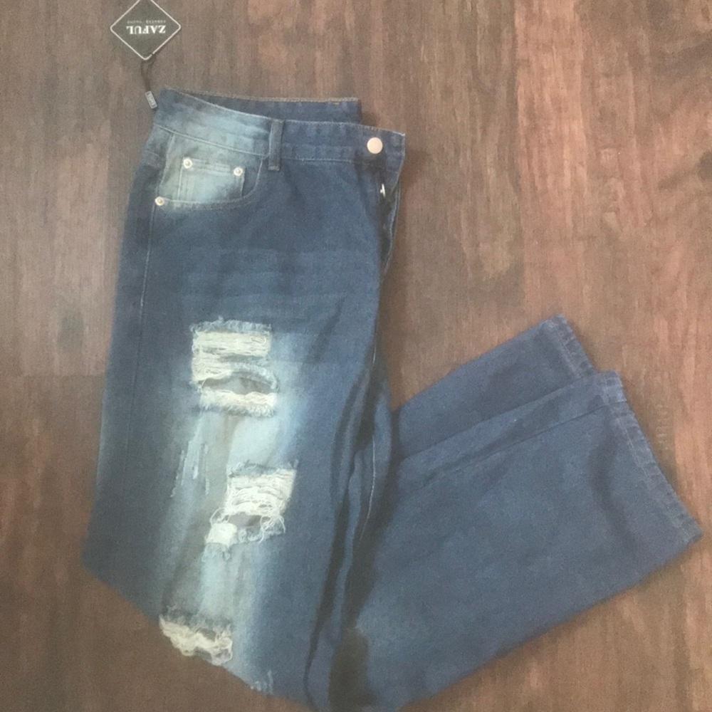 Blue ripped style jeans